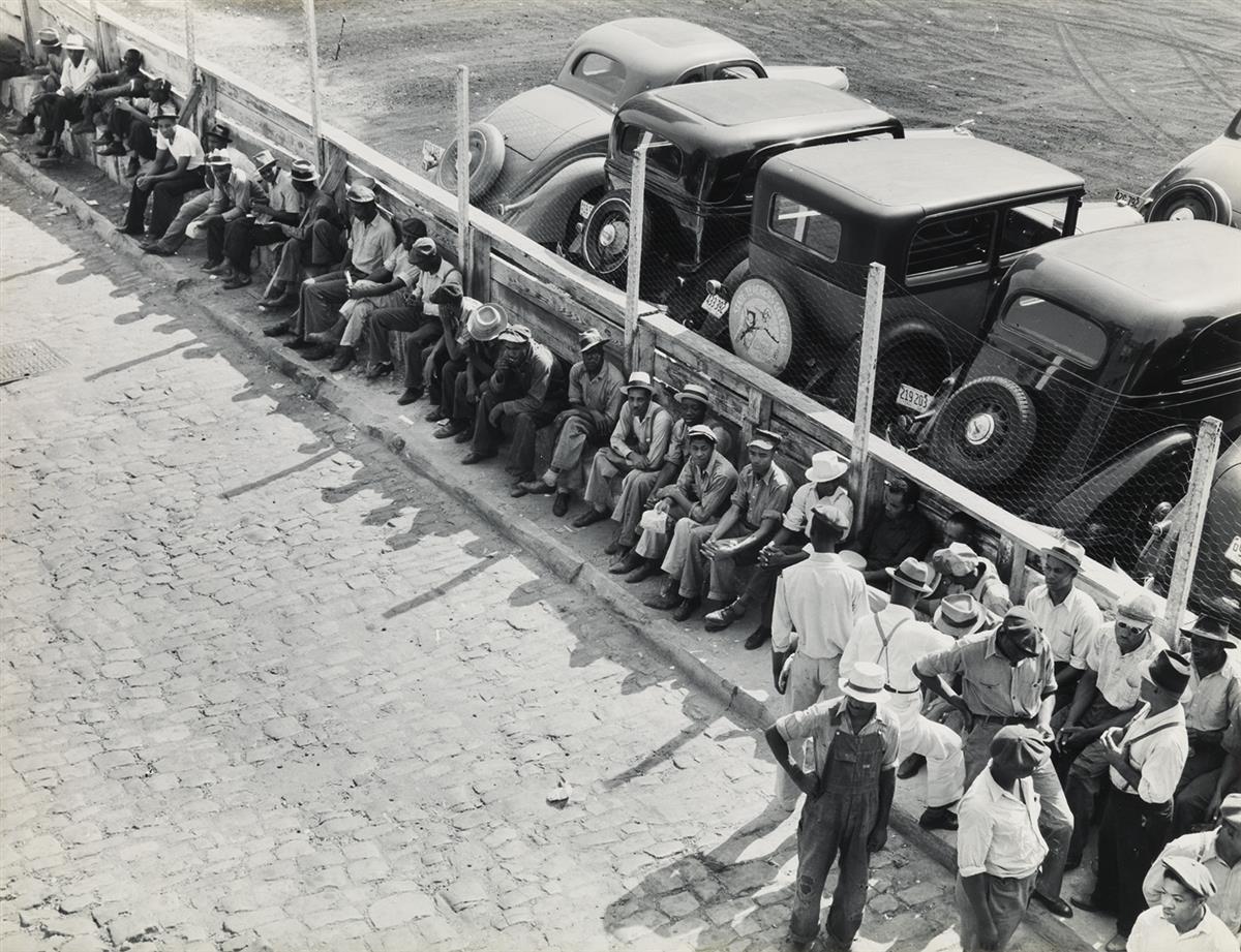 (DOROTHEA LANGE) (1895-1965) Part of the daily lineup outside the State Employment Service Office, Memphis, Tennessee.